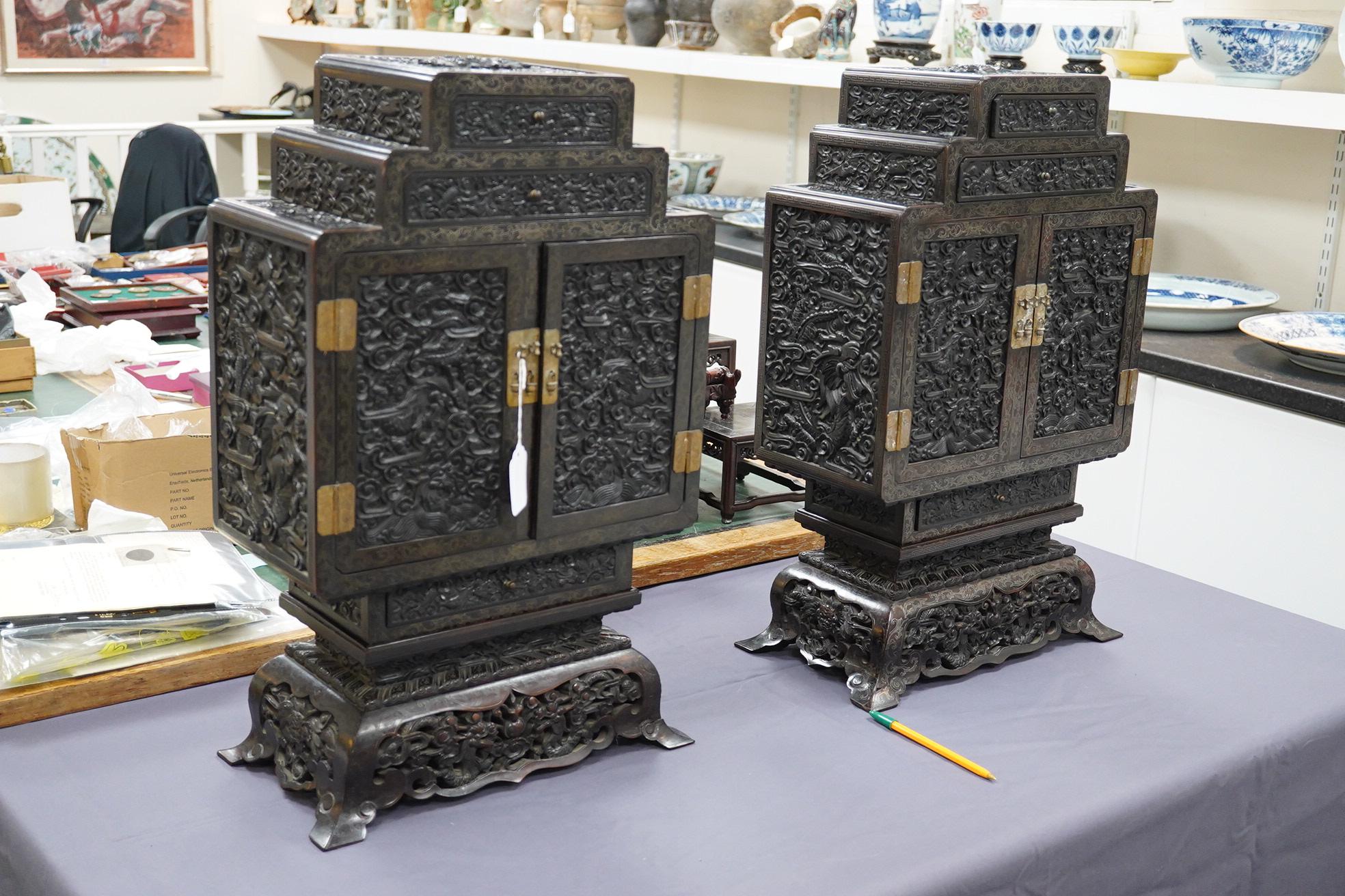 An important pair of Chinese carved zitan and silver wire inlaid ‘cloud and dragon’ curio cabinets and stands, duobaoge, probably Imperial, late Qing dynasty